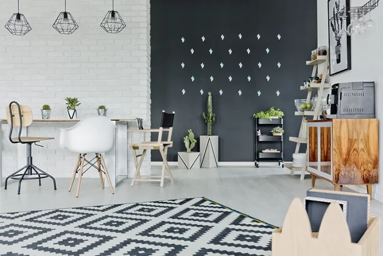 Room with a decorative chalkboard wall and patterned wood floor