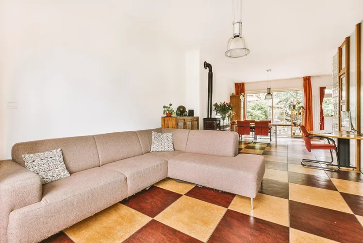 Studio apartment interior with wooden furniture over an inlaid floor