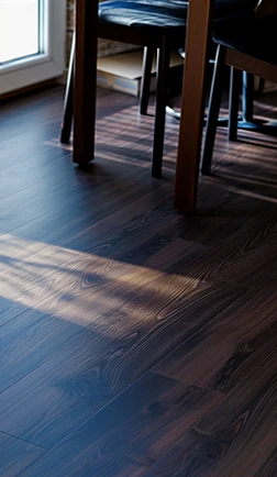 Clean, freshly polished hardwood floor reflecting daylight
