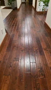 Hallway finished in rich dark hand-scraped hardwood