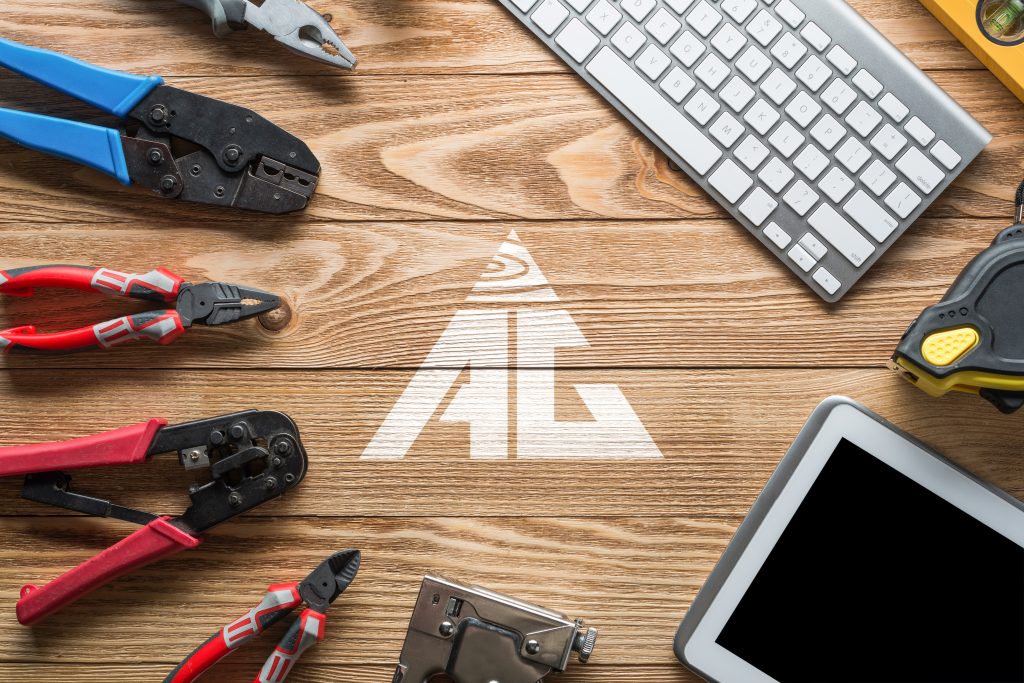 Hardwood and construction tools with the AG Floors logo in the middle